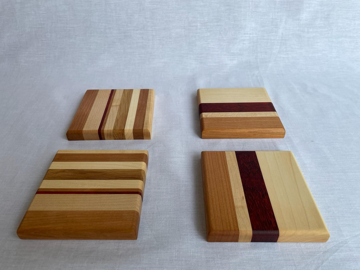 Wooden Coaster Set of 4, Handmade Six-Wood Drink Coasters in Ash, Cherry, Maple, Oak & Padauk, Housewarming Gift, Made in the Netherlands
